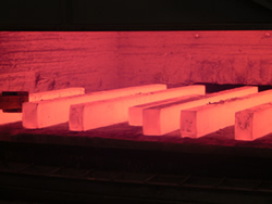 Steel blocks heated in an open-die forge in Traverse City, Michigan