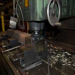 Steel being forged into blocks