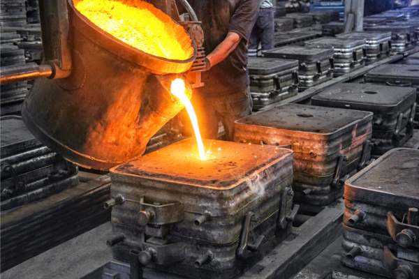 Pouring metal into cast